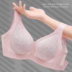 Lilac pink Lace-Illusion Soft Mesh Wireless Bra held by a hand against a gray background