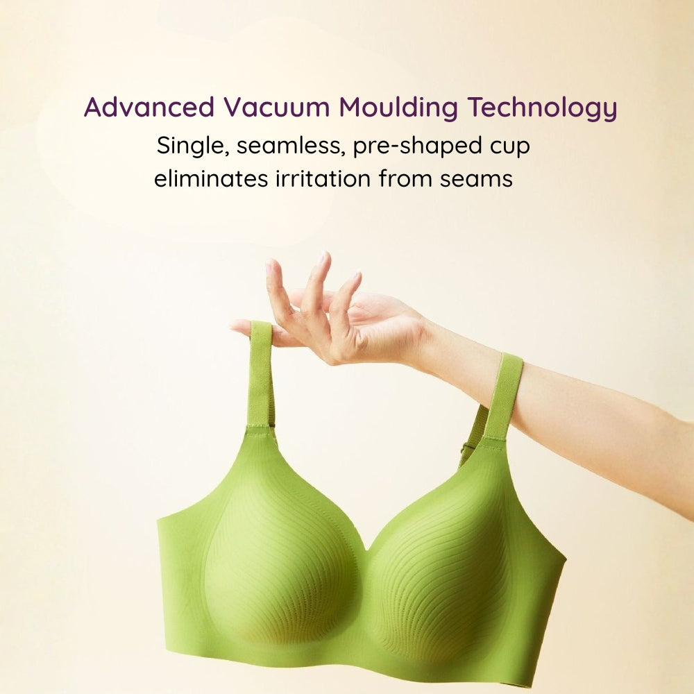 Green Air-Fit Wavy Moulded Wireless Bra held by a hand with text about advanced vacuum moulding technology 