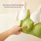 3D vacuum pad free, Green Air-Fit Wavy Moulded Wireless Bra with a hand touching it, on a beige background